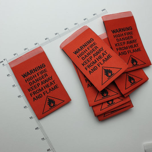 WARNING - HIGH FIRE DANGER - KEEP AWAY FROM HEAT AND FLAME - WOVEN LABELS